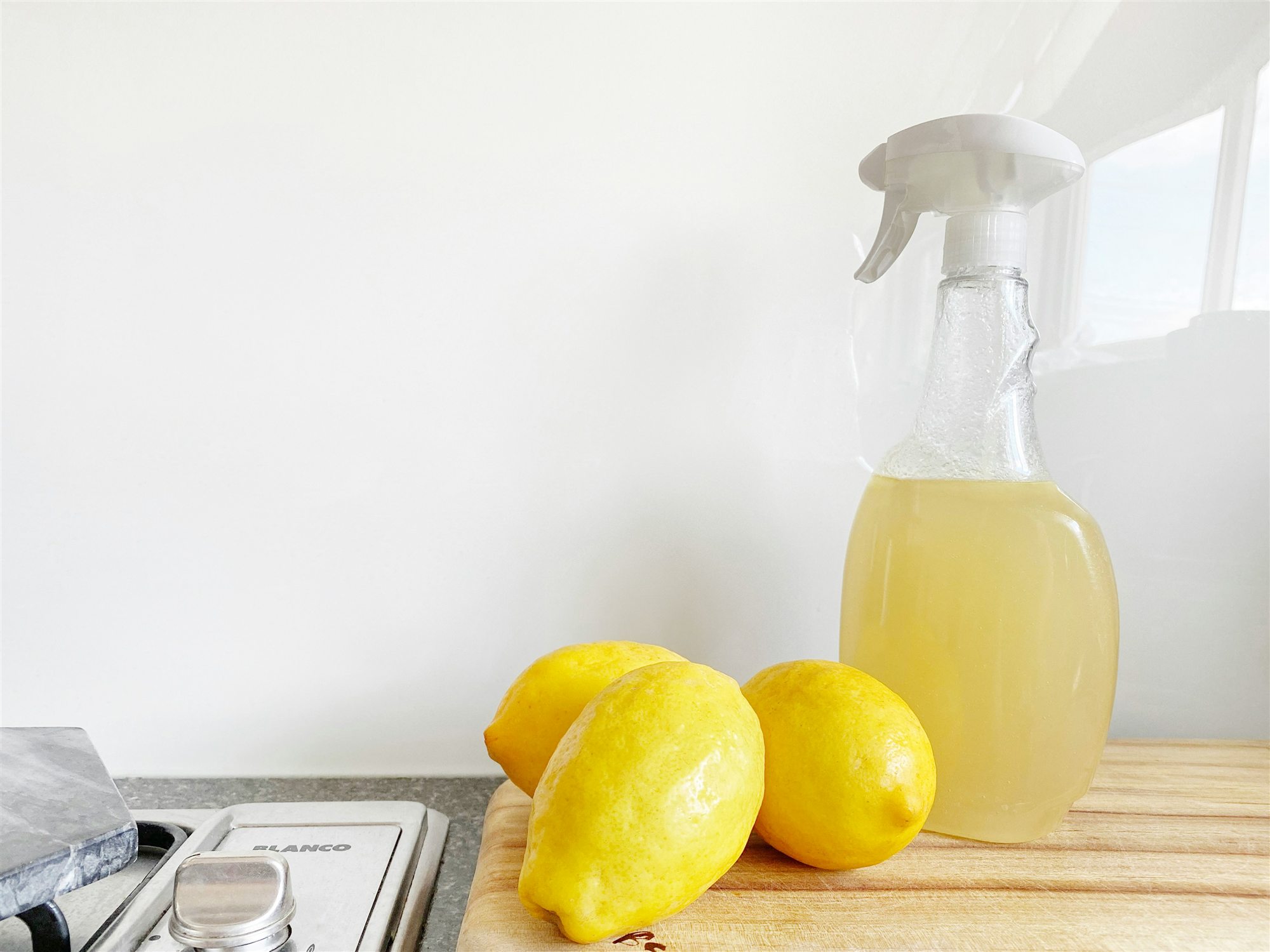 Homemade lemon cleaning spray on a counter