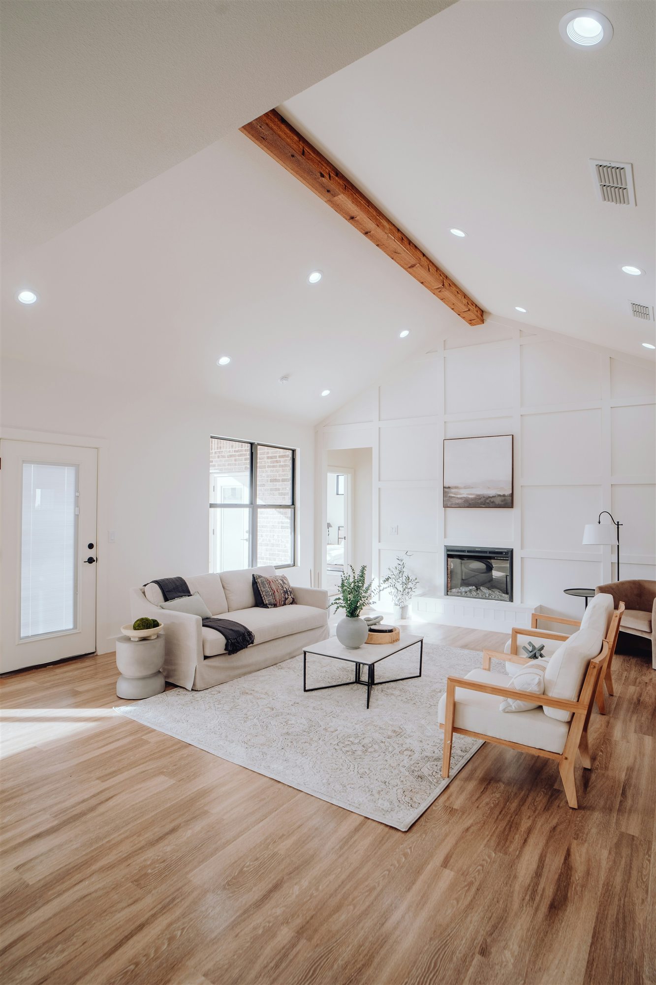 Large empty living room with clean hardwood floors